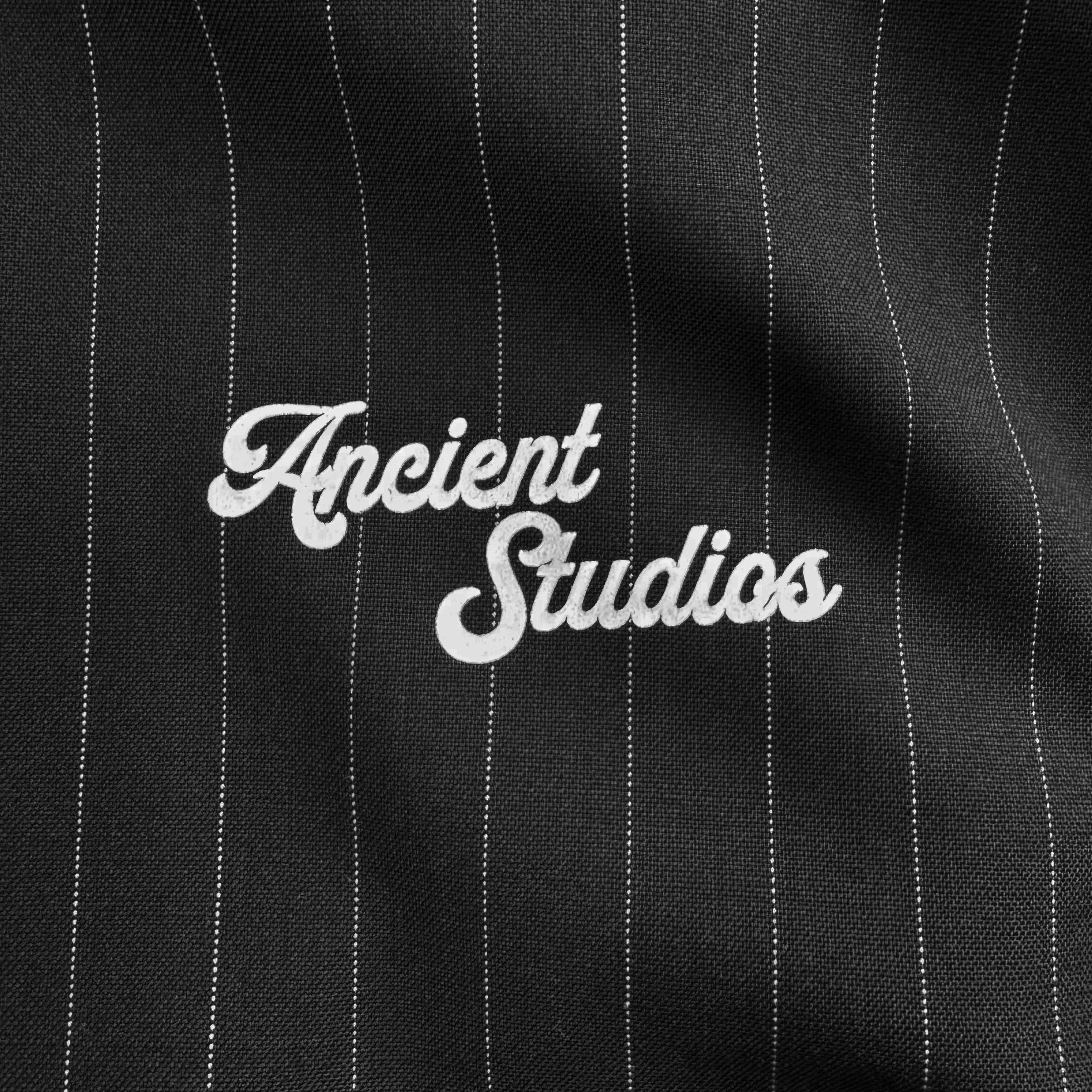 The Pinstriped Track Jacket