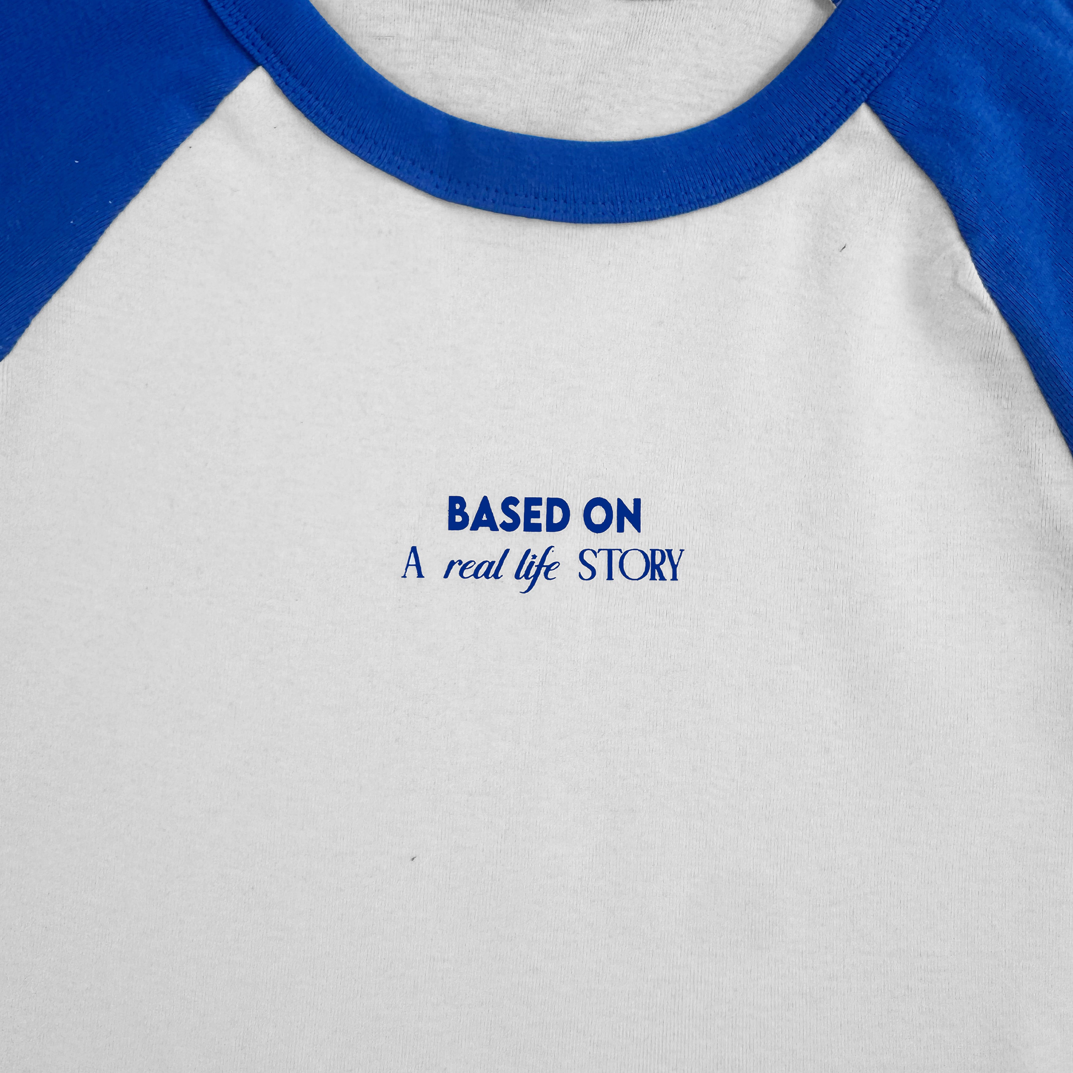 The Real Story Baby Tee